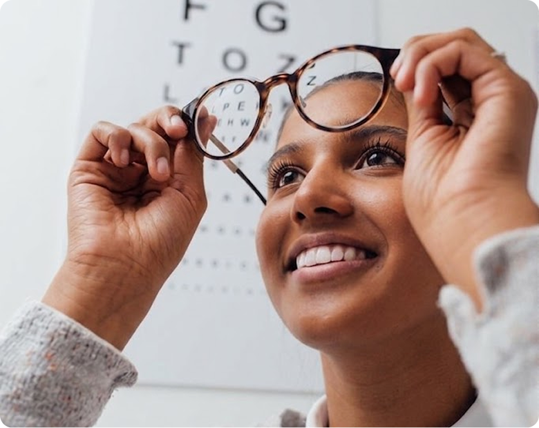 Woman reading a newspaper with reading glasses